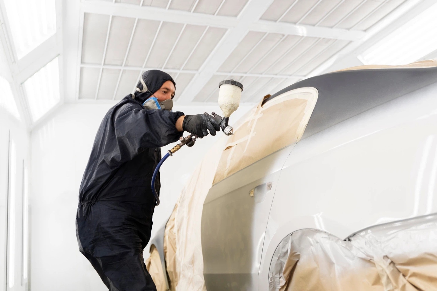 Technician applying ceramic coating on yacht surface for long-term protection