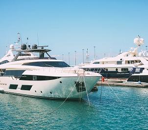 yacht on water showing polished surfaces after professional cleaning
